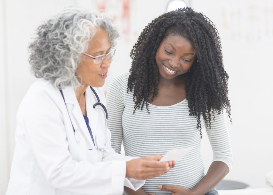 Expecting mother discussing results with doctor